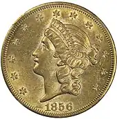 Pièce de monnaie comprenant le profil gauche d'un femme aux cheveux longs, portant un diadème avec l'inscription « Liberty ». Treize étoiles et la date, 1856.