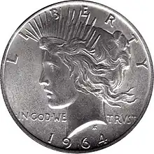 Pièce de monnaie comprenant le profil gauche d'une femme, les mots Liberty et In God we trsut et la date 1964.