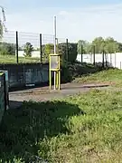 La tête de puits et l'exutoire de grisou.