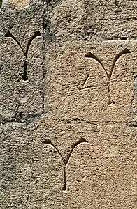 Marques de tâcheron sur le chaînage d'angle.