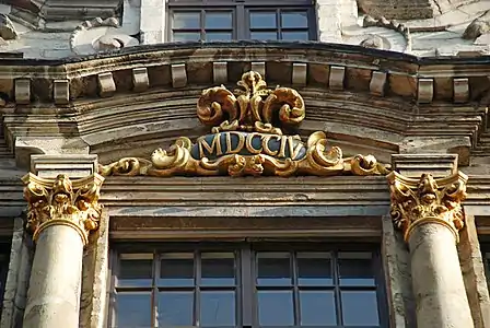 Le cartouche millésimé « MDCCIV » (1704).