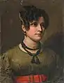 Portrait de jeune femme à la robe verte et ceinture rouge.