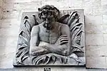 Le Cracheur, copie en pierre bleue du buste de la Fontaine Le Cracheur, Bruxelles, vers 1890.