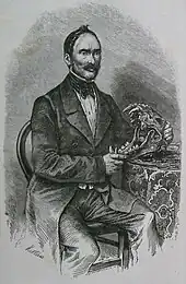 Homme sur une chaise, avec un crâne d'animal entre ses mains