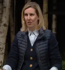 Photographie en couleurs, représentant une femme.