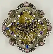 Fermail-reliquaire à l'aigle, XIVe siècle.