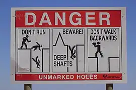 Panneau de menace de chute à Coober Pedy.