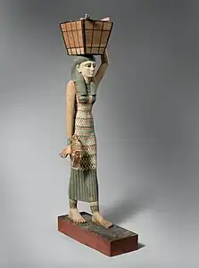 Modèle de porteuse d'offrandes. Bois peint/gesso. Déb. r. Amenemhat Ier, 1981-1975. H. 112 cm. Met