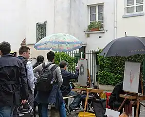 Les portraitistes de la rue Norvins, à proximité de la place du Tertre.