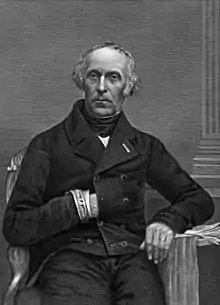 Lithographie du portrait d'un homme assis qui glisse la main gauche dans sa veste