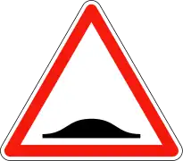 Panneau avertissant de la présence d'un ralentisseur (à 50m) générant un à-coup vertical.