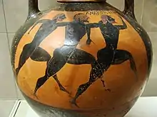 Vase noir et rouge, avec des hommes nus courant