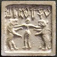 Indus valley civilization seal, with human flanked by two lions (2500–1500 BC).