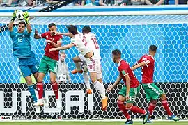 Munir réalisant une prise de balle face à l'Iran.