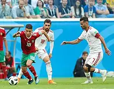 Harit après une récupération de ballon sur Alireza Jahanbakhsh.