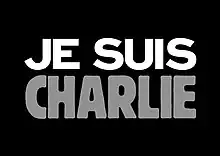 Texte « Je suis Charlie » écrit en blanc et gris sur un fond noir.