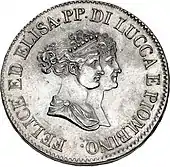 Face d'une pièce de monnaie ayant comme dessin deux visages