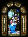 Vitrail de l'entrée représentant la nativité de NSJC