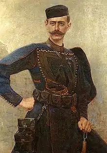tableau : portrait d'un homme moustachu avec un calot noir et des armes
