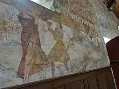 Caîn et Abel près de l'entrée, offrande et meurtre avec une pelle triangulaire.