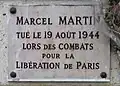 Plaque au no 221, en hommage à Marcel Martin, tué pour la Libération de Paris (1944).