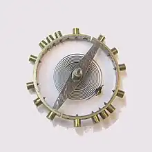 Balancier bimétallique ou compensateur.