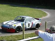 Photo d'une Porsche 911 Carrera RSR en course.