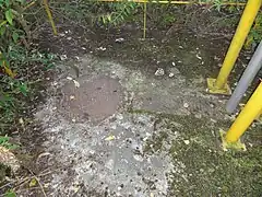 La tête de puits matérialisée.