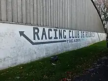 Photo d'un mur portant l'inscription Racing Club de Roubaix.