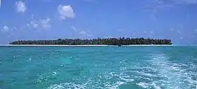 Photograph of the small, coral atoll of the island of Satawal in the Pacific Ocean.