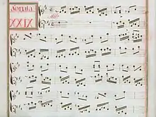 partition manuscrite rehaussée de couleurs passées rouge et vert en bordures et cadre de titre, titre en rouge