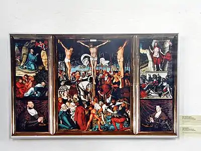 Polyptyque ouvert : panneau central entouré des panneaux centraux déployés, mais sans la prédelle.