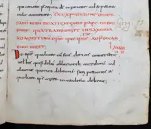 Le bas d'une page manuscrite rédigée à l'encre rouge puis noire