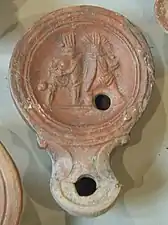 Lampe romaine en terre  cuite,  montrant  deux gladiateurs.
