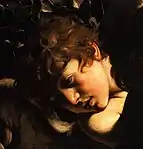 Peinture d'un visage de jeune garçon brun, frisé