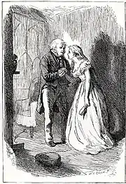 Coin de salon, Mr Wilfer, debout, serre dans ses deux mains la main droite de Bella aux longs cheveux dénoués, une brosse dans sa main gauche