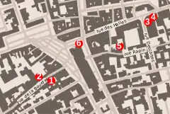 Plan en couleurs d'une ville avec des repères numérotés.