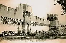 Gravure représentant un troupeau de moutons au pied de remparts