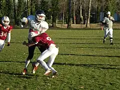 Centurions (en rouge) vs Hurricanes (en blanc) en U17, plaquage.