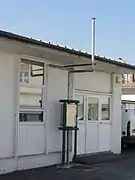 La tête de puits matérialisée et l'exutoire de grisou.