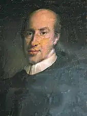 Tableau d'un homme en noir avec un col blanc