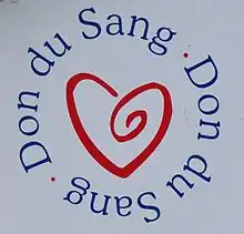 Logo représentant un cœur stylisé entouré des mots « Don du sang. »